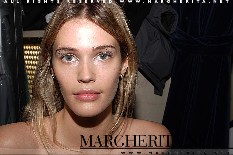 Make-up at Genny FW 2018 2019. Glitter eyes and a beautiful skin. Make-up: Lloyd Simmonds