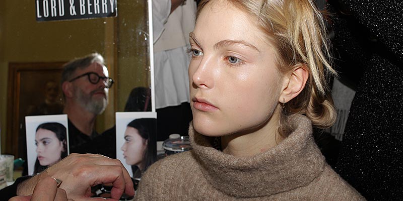 Make-up at Genny FW 2018 2019. Glitter eyes and a beautiful skin. Make-up: Lloyd Simmonds